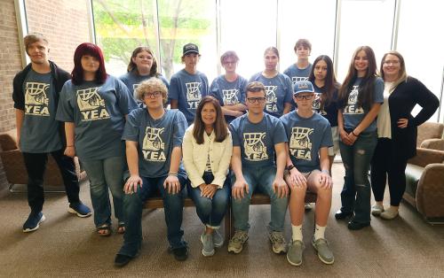 A group of people wearing Youth Entrepreneurial Academy shirts