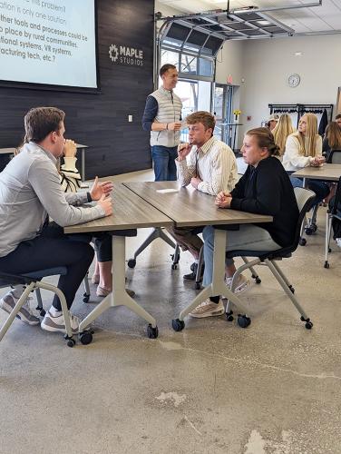 Students participate in a design challenge led by Hank Norem, CEO of Sukup Innovations, at Maple Studios in West Des Moines